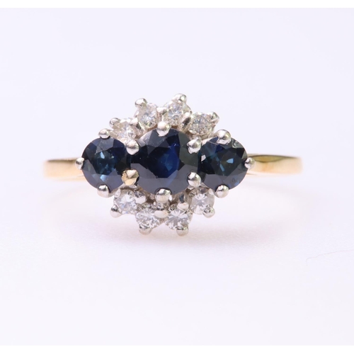 117 - 18ct yellow gold ring set with three round graduated sapphires with eight round brilliant cut diamon... 