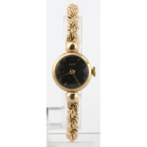 459 - Ladies 9ct cased manual wind wristwatch by Tissot circa late 1950s. The black dial with baton / arab... 