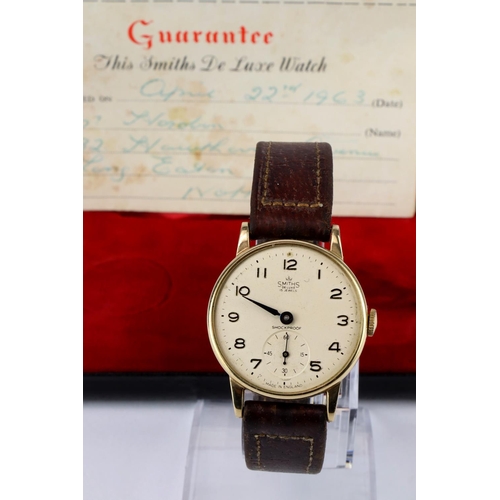 471 - Gents 9ct cased Smiths De Luxe wristwatch. Purchased 22/4/1963. Working when catalogued and in its o... 