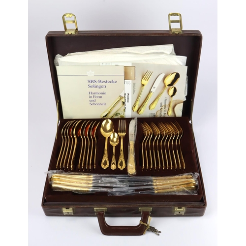 595 - German Besteke Solingen canteen of gold plated cutlery, in briefcase along with original purchase re... 