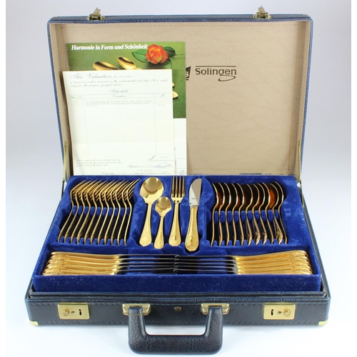 596 - German Besteke Solingen canteen of gold plated cutlery, in briefcase along with original purchase re... 