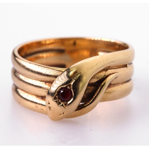 63 - 9ct yellow gold snake triple coil ring with a single round ruby measuring approx. 2.5mm, finger size... 