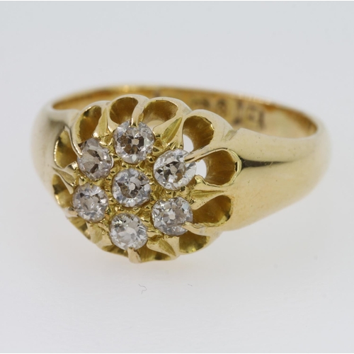 69 - 18ct yellow gold ring set with seven round old cut diamonds in a daisy clustrer design, weighing a t... 