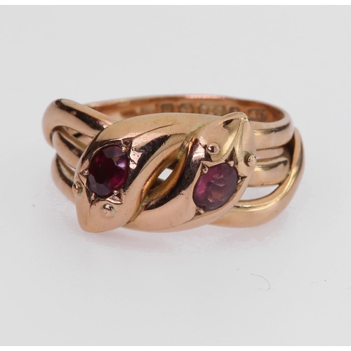 72 - 9ct rose gold double snake ring set with an oval almandine garnet in each head, finger size V/W, wei... 