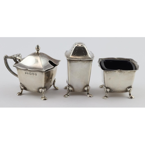 723 - Three piece cruet set, comprising of salt, pepper and mustard, including two blue glass liners. Hall... 