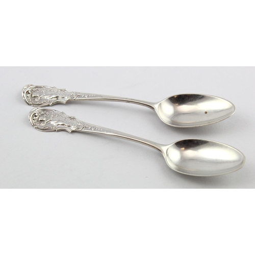 731 - Two Georgian silver Winged Cherub and Garland-front and shell and scroll back pattern teaspoons, Lon... 