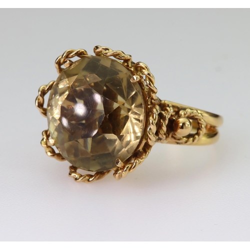 74 - 9ct yellow gold dress ring set with a single round yellow/brown quartz measuring approx. 18mm diamet... 