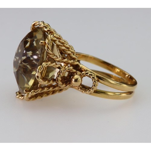 74 - 9ct yellow gold dress ring set with a single round yellow/brown quartz measuring approx. 18mm diamet... 