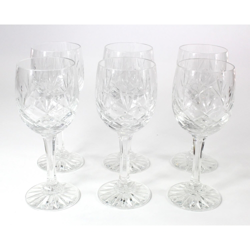 891 - Cut glass decanter & six glasses, contained in a wooden stand