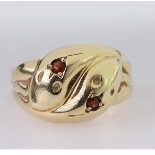 97 - 9ct yellow gold double snake ring set with a single round garnet in each snake head, finger size W, ... 