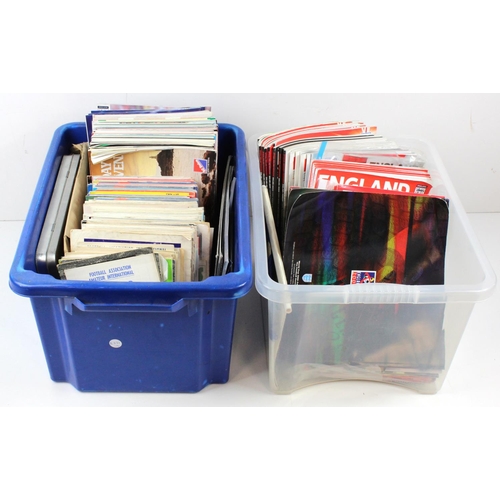 891 - Football programmes  two large plastic crates packed with modern England programmes, etc.  Heavy  (... 