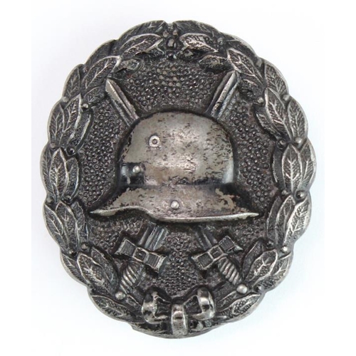 218 - German Black Wound badge, hollow backed, with award document to Reichsbahn Betriebs Assistent Josef ... 