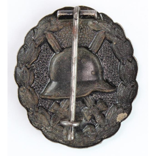 218 - German Black Wound badge, hollow backed, with award document to Reichsbahn Betriebs Assistent Josef ... 