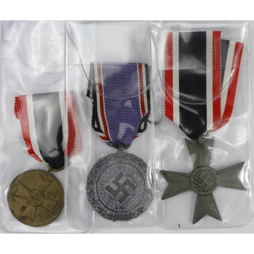 481 - German WW2 Luftschutze civil defence medal with war merit medal and war merit cross without swords.