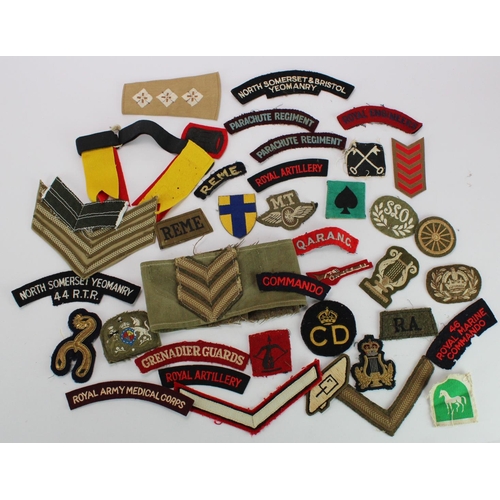 634 - British Army Cloth Insignia, including WW2 divisional and regimental badges. (approx 40 pieces)