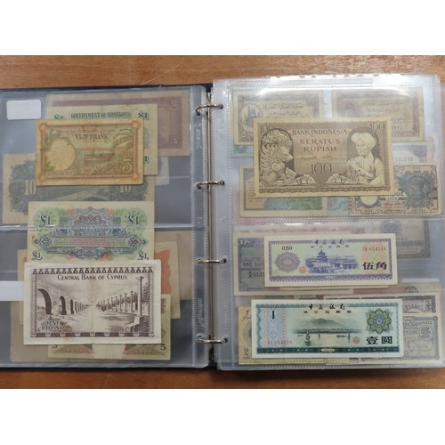 1203 - World (175), a collection in album including British West Africa, India, Malta,East African Currency... 