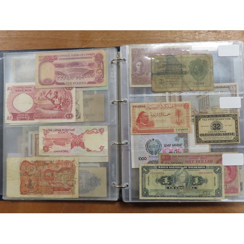 1203 - World (175), a collection in album including British West Africa, India, Malta,East African Currency... 