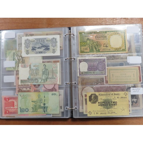 1203 - World (175), a collection in album including British West Africa, India, Malta,East African Currency... 