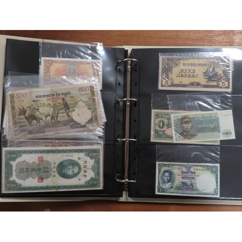 1227 - World (approx. 480) in 2 large albums in a double slipcase, one album containing all Zimbabwe notes ... 