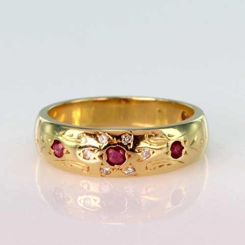 110 - 18ct yellow gold 6mm wide band ring set with three spaced graduated round rubies with six diamond po... 