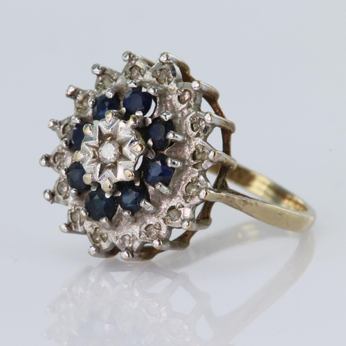 129 - 9ct yellow gold cluster dress ring set with a central round brilliant cut diamond weighing approx. 0... 