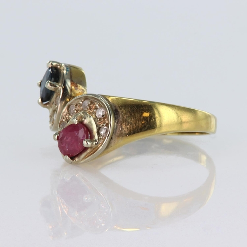 137 - 18ct yellow gold crossover style ring, one side set with an oval ruby and the other with an oval sap... 