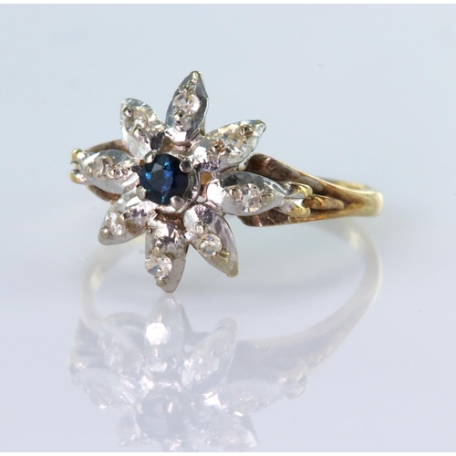 144 - 18ct yellow gold ring with white gold floral shaped head set with central round 3mm sapphire and wit... 