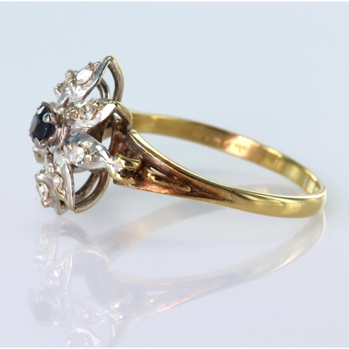 144 - 18ct yellow gold ring with white gold floral shaped head set with central round 3mm sapphire and wit... 