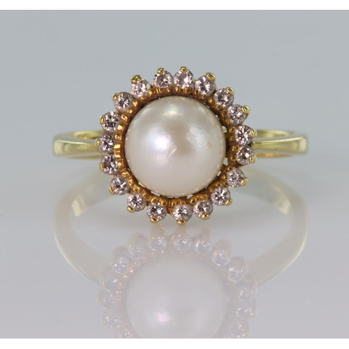 146 - 18ct yellow gold ring set with a pearl measuring approx. 8mm diameter surrounded by twenty round bri... 