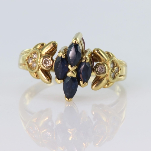 152 - 18ct yellow gold ring with a swivel head, one side displaying four marquise cut sapphires measuring ... 