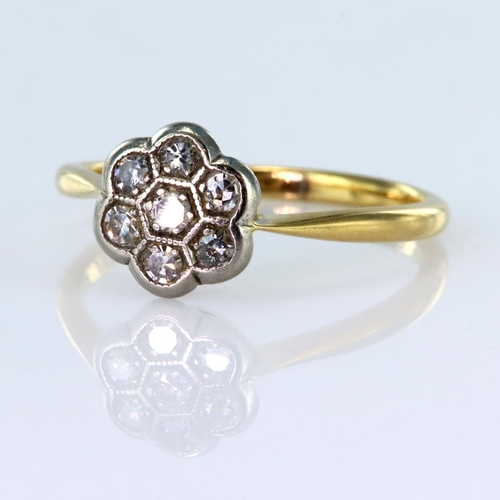 164 - 18ct yellow gold daisy cluster ring set with seven round brilliant cut diamonds totalling approx. 0.... 