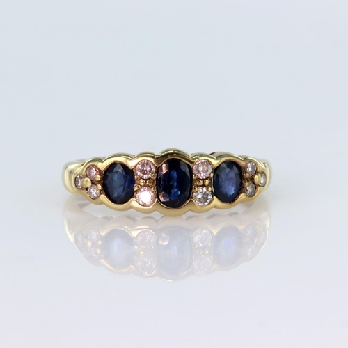 47 - 18ct yellow gold ring set with three graduated oval sapphires divided by four round brilliant cut di... 