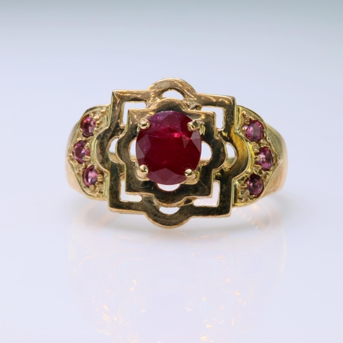 57 - 9ct yellow gold dress ring set with a central oval ruby measuring approx. 6mm x 5mm and highlighted ... 
