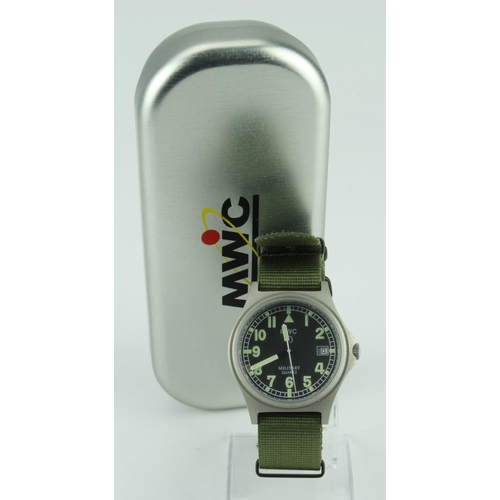 572 - Boxed as new MWC Military style quartz wristwatch with green strap, circa May 2010. Working when cat... 