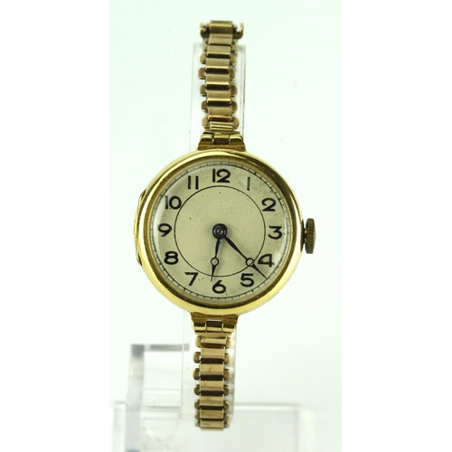 578 - Ladies 18ct cased wristwatch by Tavennes. The cream 22mm dial with black arabic numerals on a 9ct br... 