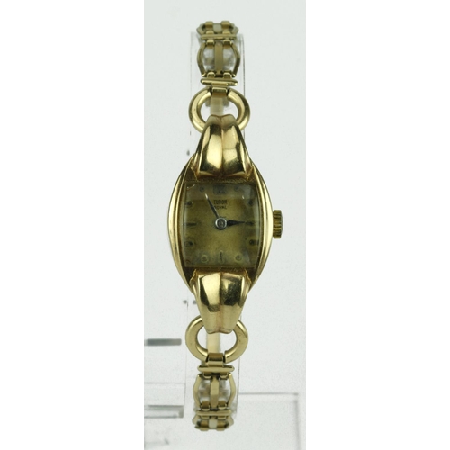 584 - Ladies 9ct cased wristwatch by Tudor, hallmarked 1952 on a rolled gold bracelet. Engraved on the bac... 