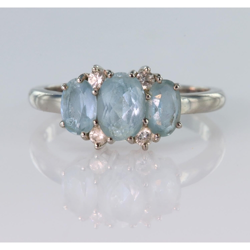 6 - 18ct white gold ring set with three oval blue topaz with four diamond highlights totalling approx. 0... 