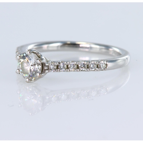 69 - 18ct white gold ring set with a certificated single round brilliant cut diamond with a diamond weigh... 