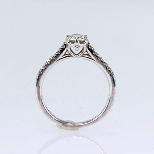 69 - 18ct white gold ring set with a certificated single round brilliant cut diamond with a diamond weigh... 