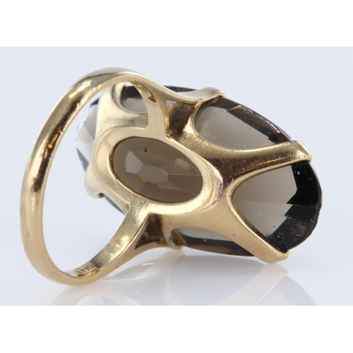 76 - 9ct yellow gold dress ring set with elongated oval smoky quartz measuring approx. 29mm x 15mm, finge... 