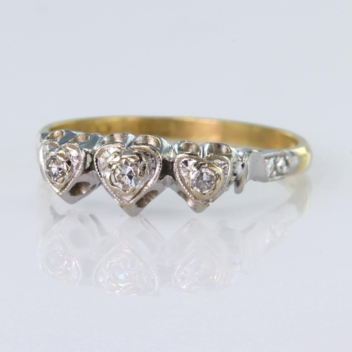 81 - 18ct yellow and white gold ring set with three round brilliant cut diamonds in heart shaped settings... 