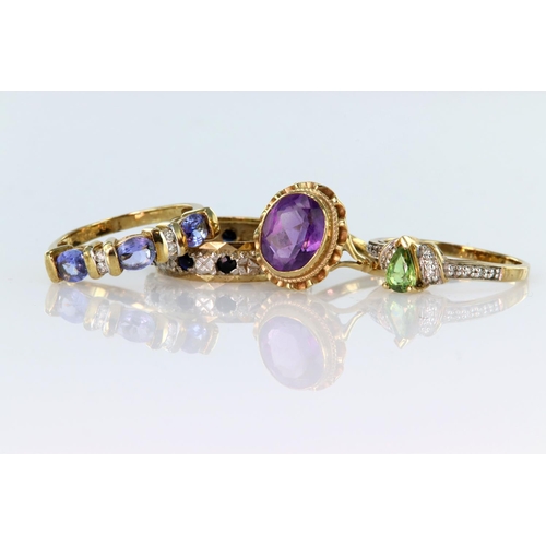 85 - Four 9ct yellow gold rings to include an amethyst single stone ring, finger size K, weight 2.3g. Tan... 