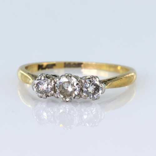 88 - 18ct and platinum ring set with three graduated round brilliant cut diamonds with a total diamond we... 