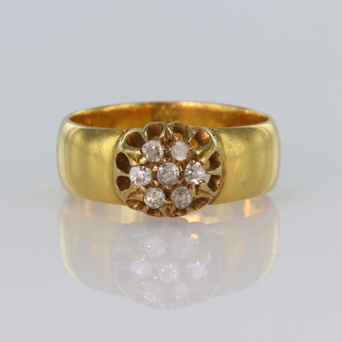 89 - 22ct yellow gold band ring with a cluster of seven round old cut diamonds in raised claw setting, to... 