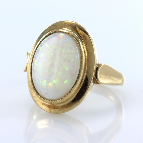 92 - 9ct yellow gold single stone ring set with an oval opal cabochon measuring approx. 14mm x 10mm, fing... 