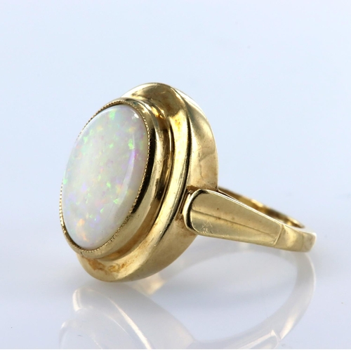 92 - 9ct yellow gold single stone ring set with an oval opal cabochon measuring approx. 14mm x 10mm, fing... 