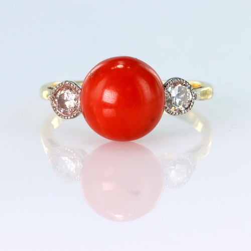 93 - 18ct yellow gold three stone ring set with a round coral bead and two round brilliant cut diamonds w... 