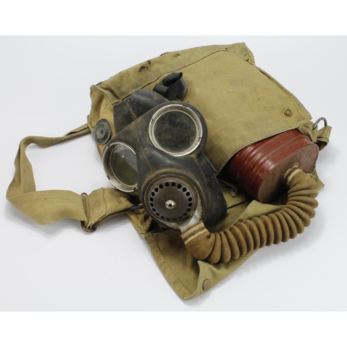 1776 - WW2 Gas mask and case dated.