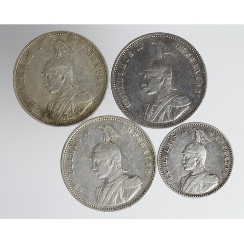 2374 - German East Africa Silver (4): 3x Rupie 1904A nVF, 1910J aEF, 1911J GVF with a spot of adhesive, and... 