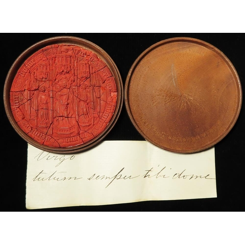 671 - Seal: An early religious wax seal 63mm cut out from a document, in an antique treen capsule, with pe... 